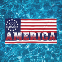 patriotic towel with '1776 - 2026 AMERICA' text on a blue water background