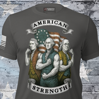 T-shirt with graphic of three founding fathers with betsy ross American flag, labeled 'American Strength', on a brick wall background.
