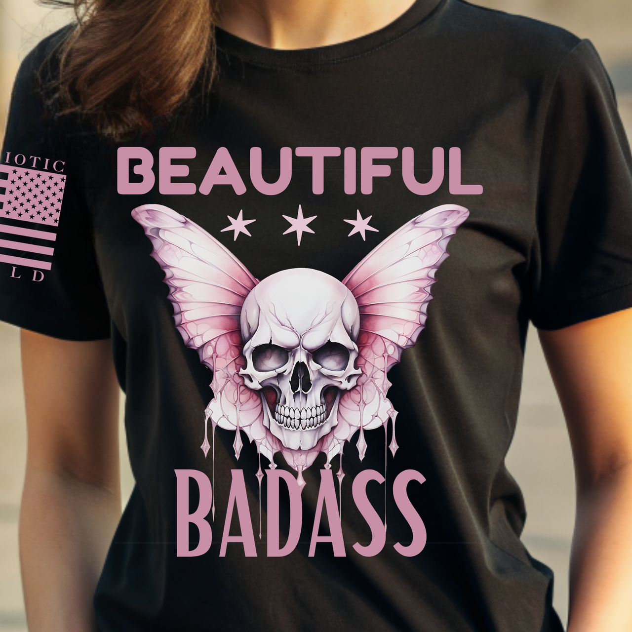 Close-up of Beautiful Badass pink skull design on women’s T-shirt