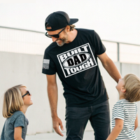 Hardworking patriotic dad wearing Built Dad Tough tee