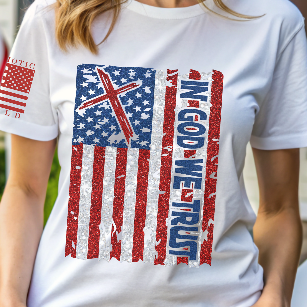 Detailed close-up of In God We Trust text on a patriotic women’s T-shirt