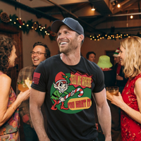 Adult Christmas humor T-shirt with cheeky elf graphic and suggestive holiday saying for fun loving americans