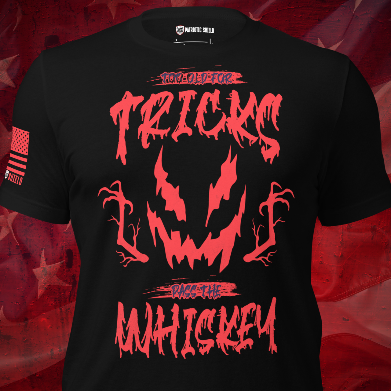 A black short-sleeve graphic T-shirt displayed on a torso mannequin against a red textured background. The shirt features a large red horror-style graphic with the text '100% OLD FOR TRICKS' and 'DAGGER THE WHISKEY' around a jagged face design.