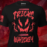 A black short-sleeve graphic T-shirt displayed on a torso mannequin against a red textured background. The shirt features a large red horror-style graphic with the text '100% OLD FOR TRICKS' and 'DAGGER THE WHISKEY' around a jagged face design.