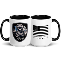 white mug with black handle patriotic shield logo. 15 oz