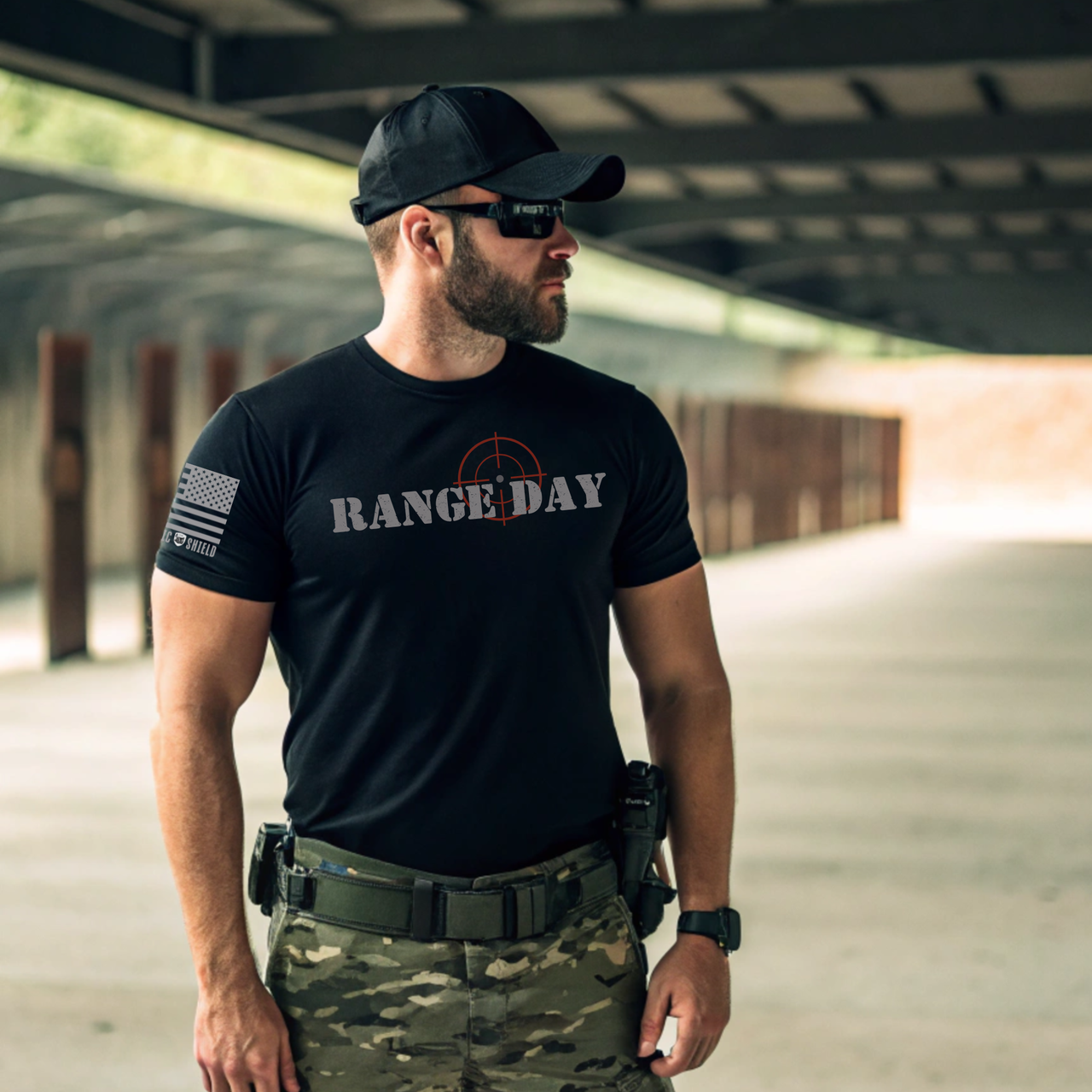 Veteran wearing Range Day tee at shooting range